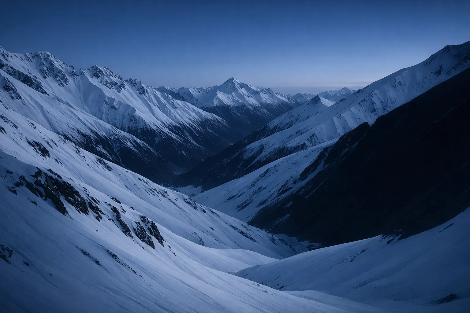 Pure blue snow valley corridor through alpine mountains
